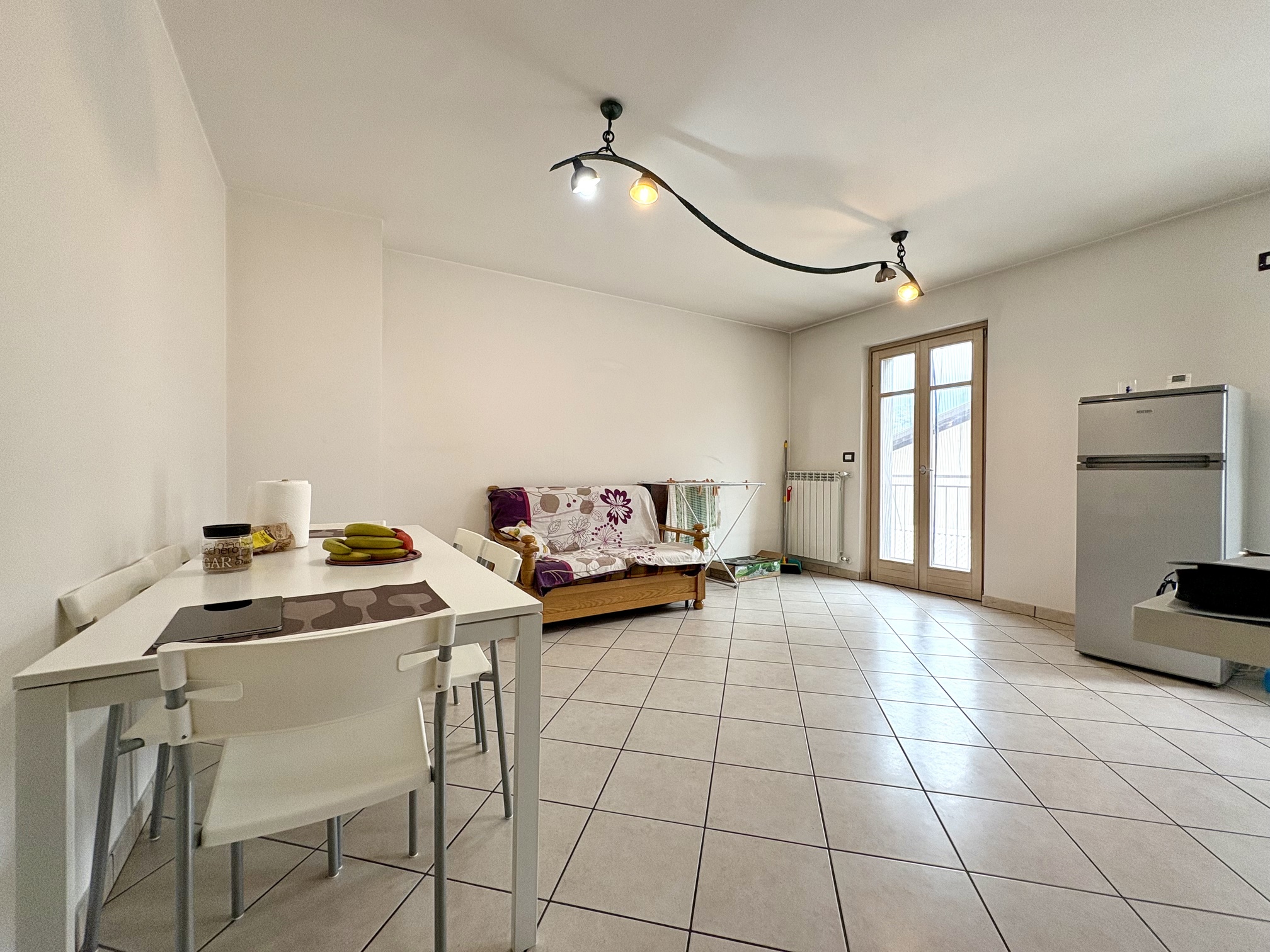 Bilocale con posto auto coperto nel cuore di Piancogno